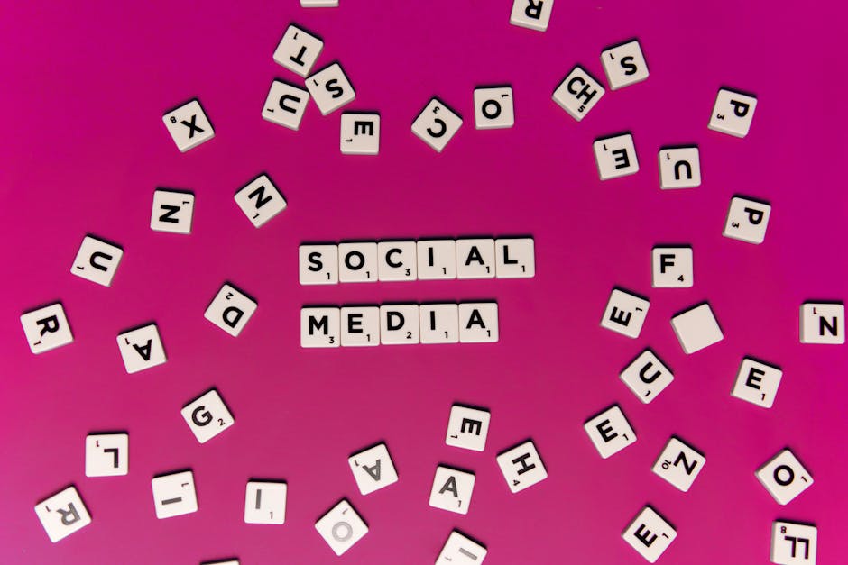 Alphabet tiles forming 'Social Media' on a vibrant pink background, perfect for digital marketing themes